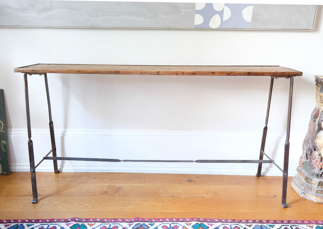 Rustic pine console table with wrought iron twisted legs and curled feet
