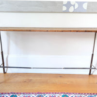 Rustic pine console table with wrought iron twisted legs and curled feet