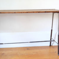 Industrial hallway console table with iron frame and bolted plank top