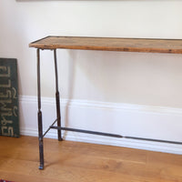 Rustic pine console table with wrought iron twisted legs and curled feet