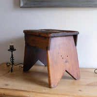 V cut legs on a 19th Century Vernacular Pine Stool with V-Cut Sides and Worn Grab Handle Seat