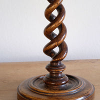 Pair of tall antique oak open barley twist candlesticks with original brass sconces and weighted circular bases