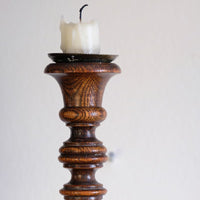 Pair of tall antique oak open barley twist candlesticks with original brass sconces and weighted circular bases