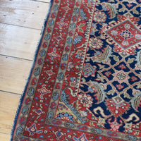 corner fringe detail on an Antique North-West Persian runner displayed upright in natural light