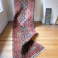 Hand-knotted Persian hallway runner measuring 302 × 72 cm