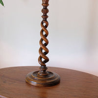 Antique English oak open barley-twist candlestick dating to circa 1900