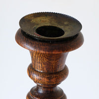 Naturally aged brass candle sconce with oxidation and traces of old wax