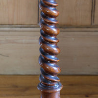 Mid-Victorian burr walnut candle stand with fixed candle arm and barley-twist column