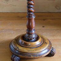 Mid-Victorian burr walnut candle stand with fixed candle arm and barley-twist column