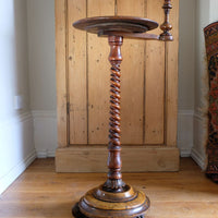 a view from the underneath on the Mid-Victorian burr walnut candle stand with fixed candle arm and barley-twist column