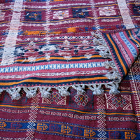Back of the Monumental mid-20th century Moroccan Berber flatweave rug with red and indigo geometric patterns