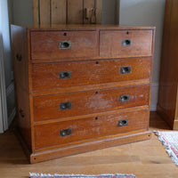 Mid-19th century camphor wood two-part campaign chest with five drawers and recessed brass handles.