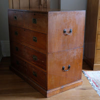 Mid-19th century camphor wood two-part campaign chest with five drawers and recessed brass handles.