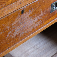 Close-up of original wear and patina across the camphor wood drawer fronts.