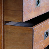 Dovetail drawer detail on the Mid-19th century camphor wood two-part campaign chest with five drawers and recessed brass handles.