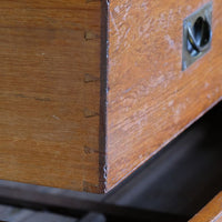 Dovetail drawer detail on the Mid-19th century camphor wood two-part campaign chest with five drawers and recessed brass handles.