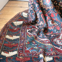 Early 20th century Persian Qashqai wool rug with indigo field, three medallions and blue-green corners, 244 × 159 cm