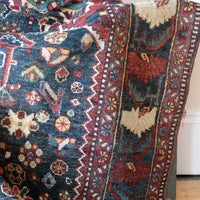 Early 20th century Persian Qashqai wool rug with indigo field, three medallions and blue-green corners, 244 × 159 cm