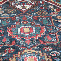 Early 20th century Persian Qashqai wool rug with indigo field, three medallions and blue-green corners, 244 × 159 cm
