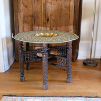 Anglo Indian folding table with brass top and carved legs