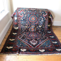 Early 20th century Persian Qashqai wool rug with indigo field, three medallions and blue-green corners, 244 × 159 cm
