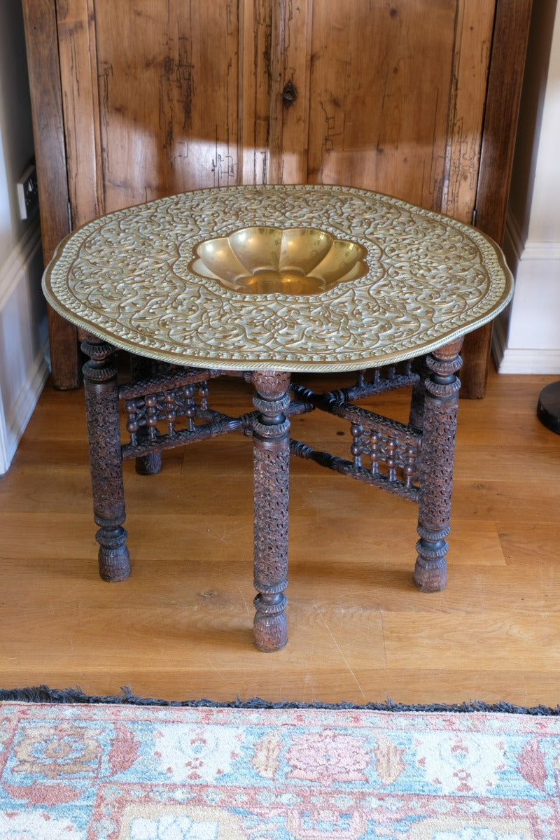 Anglo Indian folding table with brass top and carved legs