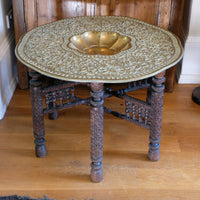 Anglo Indian folding table with brass top and carved legs
