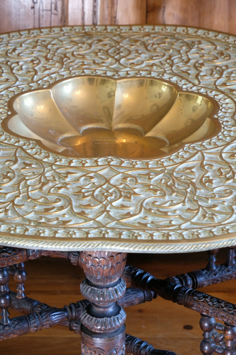 Decorative brass top with scalloped bowl on Anglo Indian table