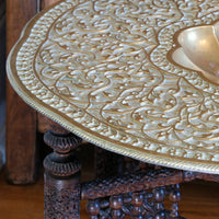 Anglo Indian folding table with brass top and carved legs