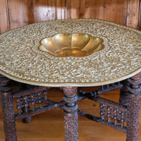Anglo Indian folding table with brass top and carved legs