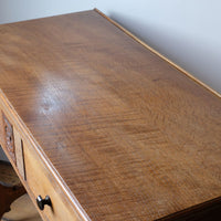 Medullary rays throughout the oak top and side on the Arts & Crafts oak console table by Beresford & Hicks with two drawers and shaped trestle supports