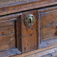 18th century country oak side table with a single panelled drawer, brass handles and baluster-turned front legs