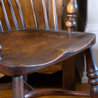 Elm saddle seat of 19th century Windsor chair