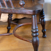 Crinoline stretcher under Windsor armchair