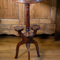 Antique Victorian mahogany tripod wine table with parquetry inlaid top and three lower rests