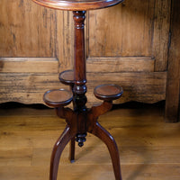 Antique Victorian mahogany tripod wine table with parquetry inlaid top and three lower rests