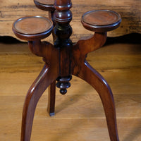 Antique Victorian mahogany tripod wine table with parquetry inlaid top and three lower rests