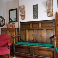 19th century Welsh oak panelled hall settle with storage and green painted finish