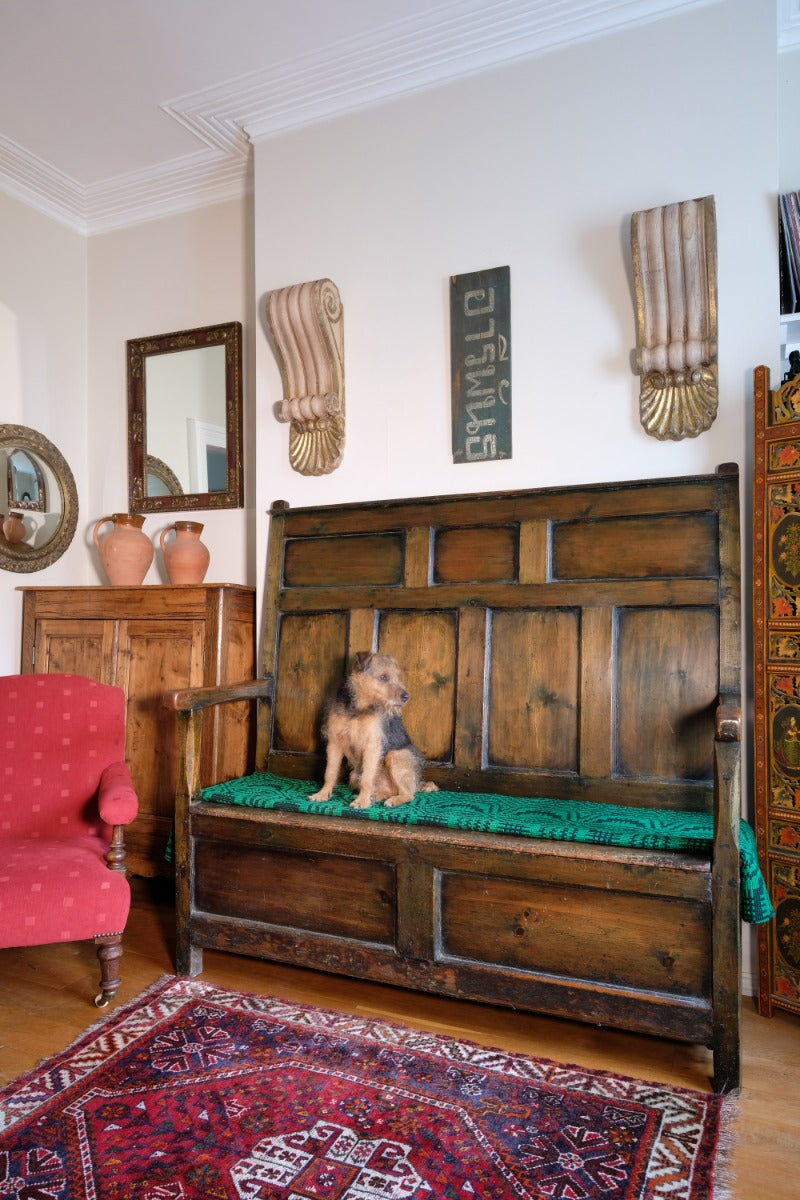 19th century Welsh oak panelled hall settle with storage and green painted finish
