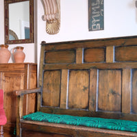 19th century Welsh oak panelled hall settle with storage and green painted finish