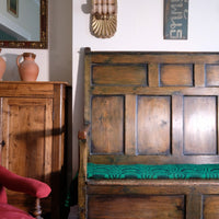 19th century Welsh oak panelled hall settle with storage and green painted finish