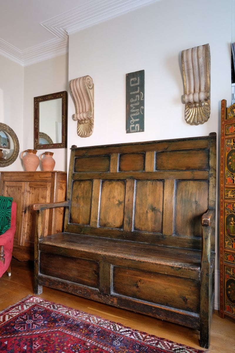 19th century Welsh oak panelled hall settle with storage and green painted finish
