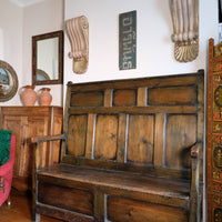 19th century Welsh oak panelled hall settle with storage and green painted finish