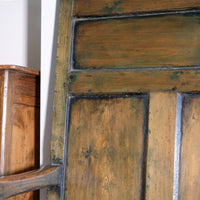 19th century Welsh oak panelled hall settle with storage and green painted finish