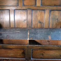 19th century Welsh oak panelled hall settle with storage and green painted finish