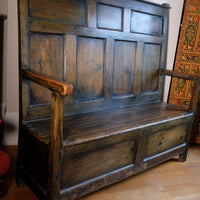 19th century Welsh oak panelled hall settle with storage and green painted finish