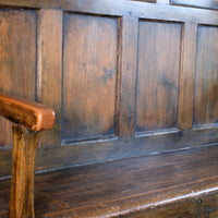 19th century Welsh oak panelled hall settle with storage and green painted finish