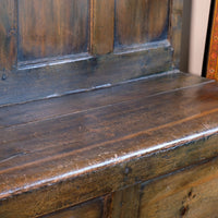 19th century Welsh oak panelled hall settle with storage and green painted finish
