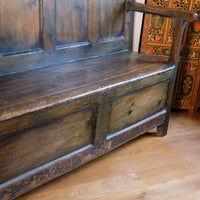 19th century Welsh oak panelled hall settle with storage and green painted finish