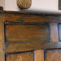 19th century Welsh oak panelled hall settle with storage and green painted finish